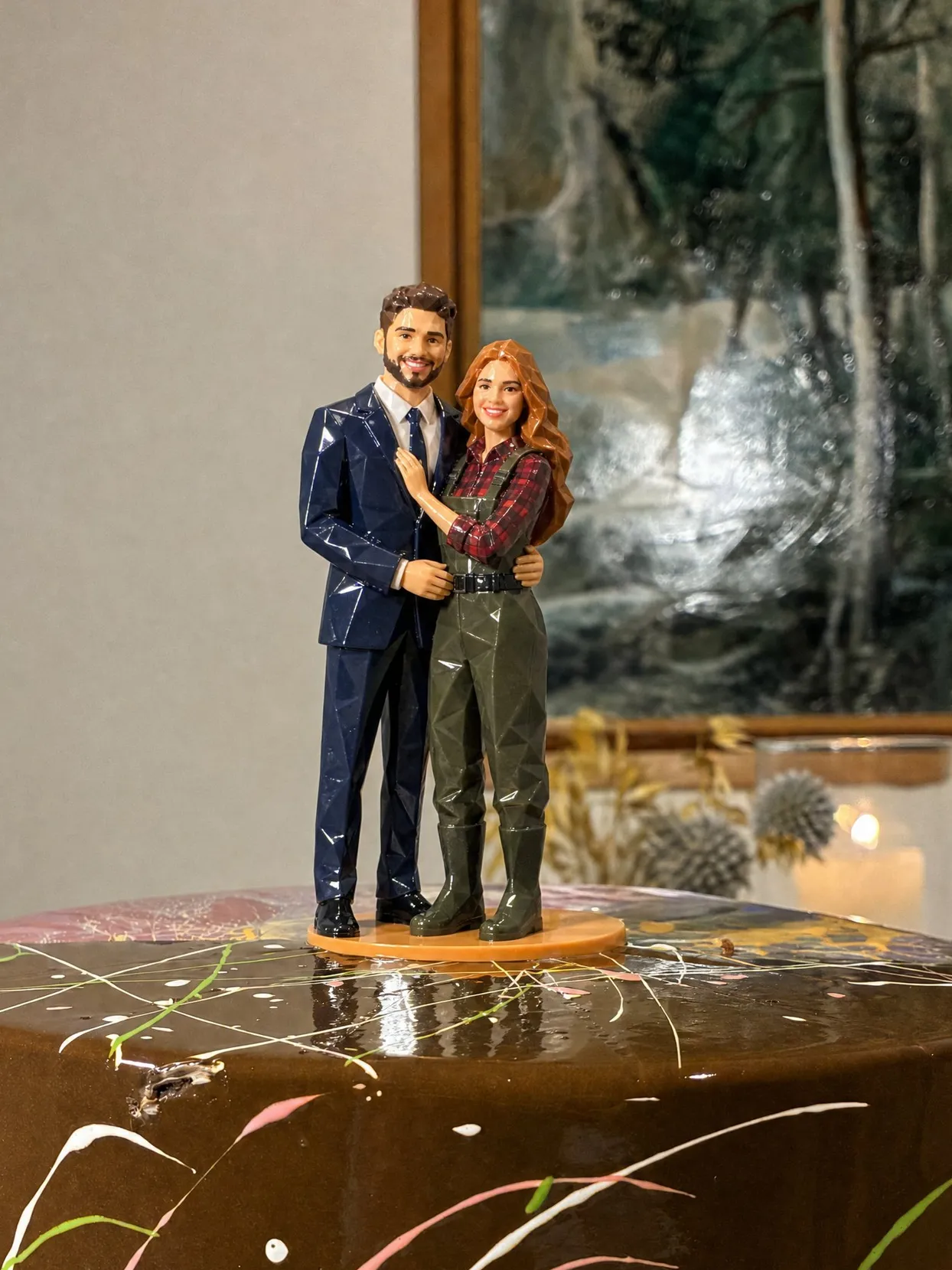 The same topper couple: she in olive waders over a red and navy plaid shirt, he in a navy suit.