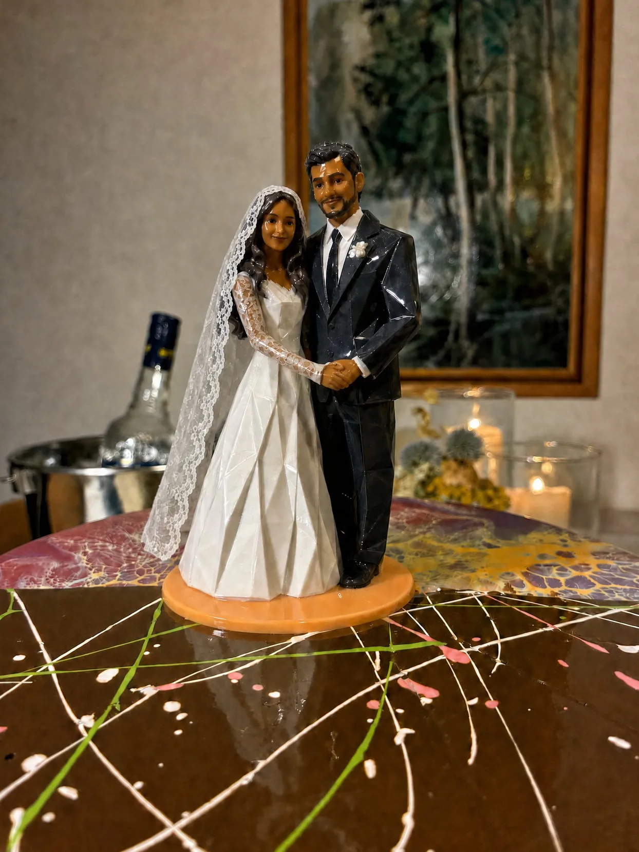 The same couple on the orange base, the bride in a long white veil with a wide lace border falling past her waist, no cord.