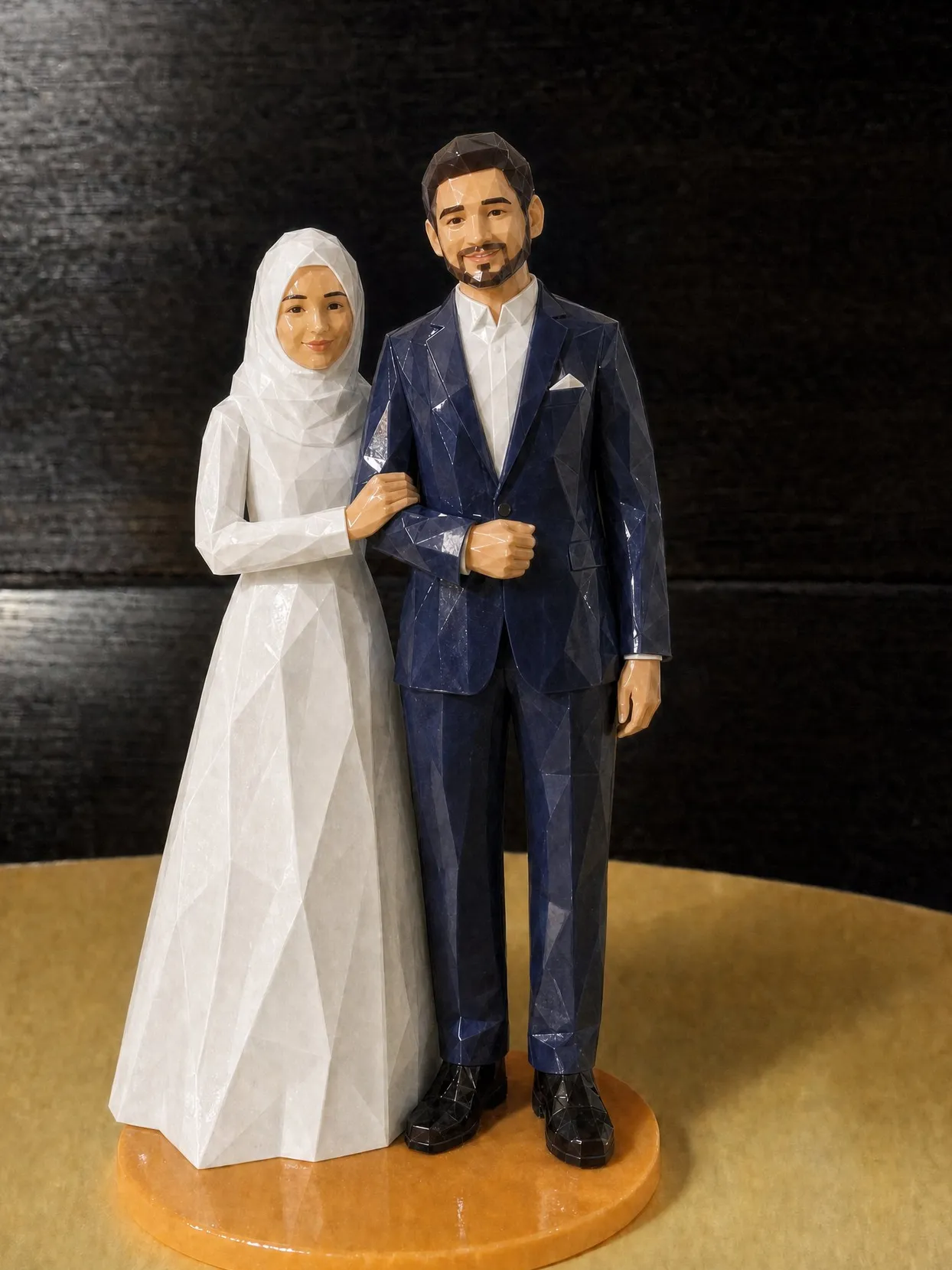 The same couple as a topper on an orange base. The bride wears a white hijab and a long-sleeved white gown. The groom wears a navy suit and a white shirt with no tie.